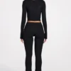 Pantalones acampanados de talle medio Philippa Modal en negro