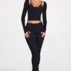 Pantalones acampanados de talle medio Philippa Modal en negro