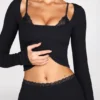 Pantalones acampanados de talle medio Philippa Modal en negro