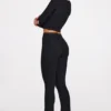 Pantalones acampanados de talle medio Philippa Modal en negro
