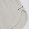 Pantalones Cortos de talle medio con detalle de botones en gris claro