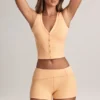 Pantalones Cortos Nina de modal con vuelta y talle medio en color melocotón