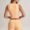 Pantalones Cortos Nina de modal con vuelta y talle medio en color melocotón