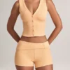 Pantalones Cortos Nina de modal con vuelta y talle medio en color melocotón