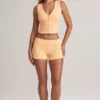Pantalones Cortos Nina de modal con vuelta y talle medio en color melocotón