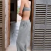 Pantalones de chándal de algodón texturizado con botones, de talle bajo y pierna ancha en gris oscuro