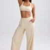 Pantalones de chándal de rizo de pierna ancha en color crema