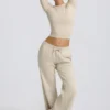 Pantalones de chándal de talle bajo y pierna ancha en color hueso