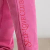 Pantalones de chándal oversize de jersey cepillado en rosa intenso