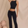 Pantalones rectos de talle medio Hollis en negro