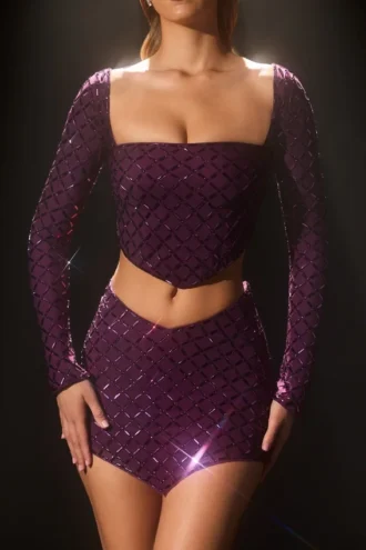 Partes de arriba asimétricas con adornos Thora en morado oscuro