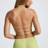 Partes de arriba asimétricas con cuello halter y espalda abierta Elania en verde oliva