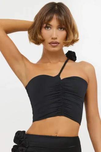 Partes de arriba asimétricas de jersey elástico con detalle de rosa de Tesia en negro