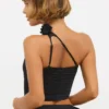 Partes de arriba asimétricas de jersey elástico con detalle de rosa de Tesia en negro