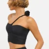 Partes de arriba asimétricas de jersey elástico con detalle de rosa de Tesia en negro