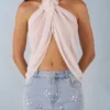 Partes de arriba con cuello halter y abertura frontal Virelle en color marfil