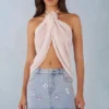 Partes de arriba con cuello halter y abertura frontal Virelle en color marfil