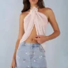 Partes de arriba con cuello halter y abertura frontal Virelle en color marfil