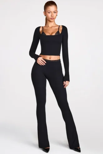 Pantalones acampanados de talle medio Philippa Modal en negro