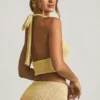 Partes de arriba cortas con cuello halter Gianna de bouclé en amarillo