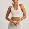 Partes de arriba cortas con cuello halter Gianna en bouclé blanco