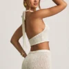 Partes de arriba cortas con cuello halter Gianna en bouclé blanco