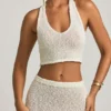 Partes de arriba cortas con cuello halter Gianna en bouclé blanco