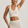 Partes de arriba cortas con cuello halter Gianna en bouclé blanco