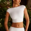 Partes de arriba cortas con mangas casquillo y espalda abierta Juno en blanco