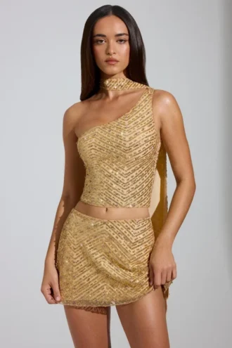 Partes de arriba Cosette asimétricas con detalle de pañuelo y adornos en dorado