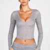 Partes de arriba de manga larga con escote pronunciado de jersey transparente Liah en gris