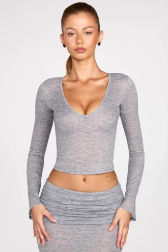 Partes de arriba de manga larga con escote pronunciado de jersey transparente Liah en gris