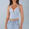 Partes de arriba estilo corsé de denim con cuello halter Lotta en denim claro