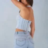 Partes de arriba estilo corsé de denim con cuello halter Lotta en denim claro
