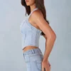 Partes de arriba estilo corsé de denim con cuello halter Lotta en denim claro