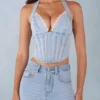 Partes de arriba estilo corsé de denim con cuello halter Lotta en denim claro