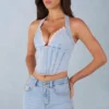 Partes de arriba estilo corsé de denim con cuello halter Lotta en denim claro