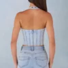 Partes de arriba estilo corsé de denim con cuello halter Lotta en denim claro