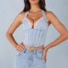 Partes de arriba estilo corsé de denim con cuello halter Lotta en denim claro