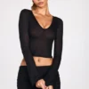 Partes de arriba largas de manga larga con escote pronunciado de jersey transparente Liah en negro