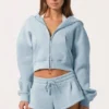Sudadera con capucha oversize con cremallera en azul claro