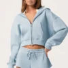 Sudadera con capucha oversize con cremallera en azul claro