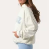 Sudadera con capucha oversize y apliques en color Milk con lunares