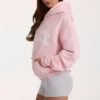 Sudadera con capucha oversize y apliques en color rosa palo
