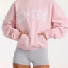 Sudadera con capucha oversize y apliques en color rosa palo