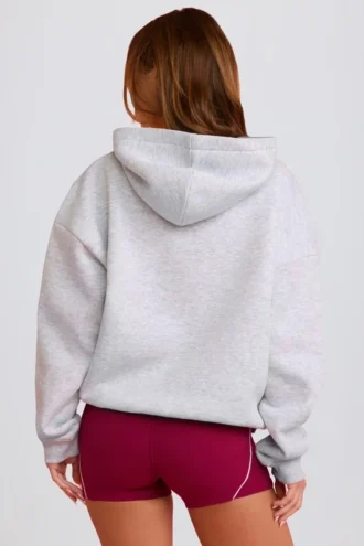 Sudadera con capucha oversize y apliques en gris