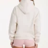 Sudadera con capucha oversize y apliques en marfil