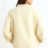 Sudadera con cremallera de un cuarto en color hueso