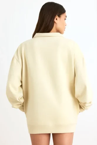 Sudadera con cremallera de un cuarto en color hueso