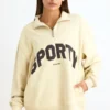 Sudadera con cremallera de un cuarto en color hueso